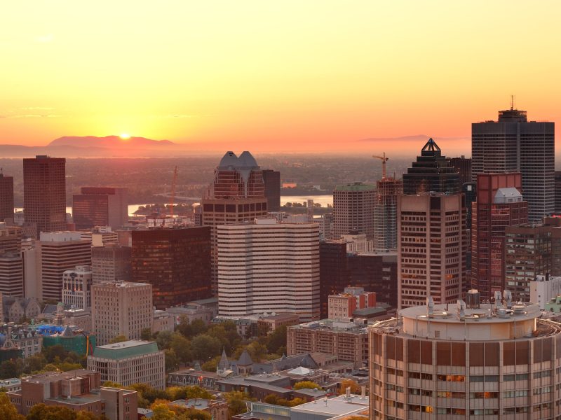 Montreal sunrise viewed from Mont Royal with city skyline in the morning